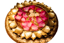 Lotus urli with rosepetals and candles