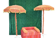 Velvet Green Backdrop with umbrellas and orange seating